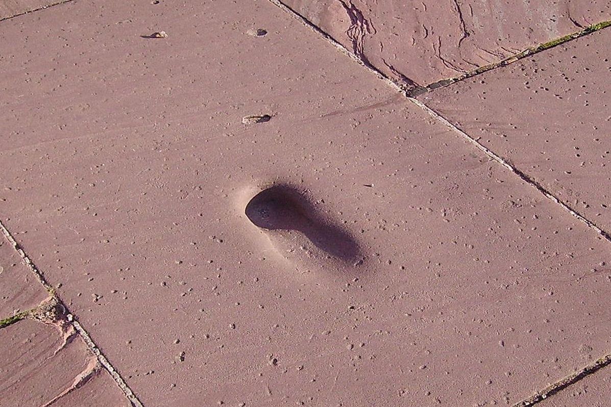 View of a shoe-shaped imprint on a cobblestone of the Great Terrace